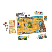 Az Andor: The Family Fantasy Game társasjáték kiterítve, játéktáblával, figurákkal, kártyákkal és zsetonokkal.