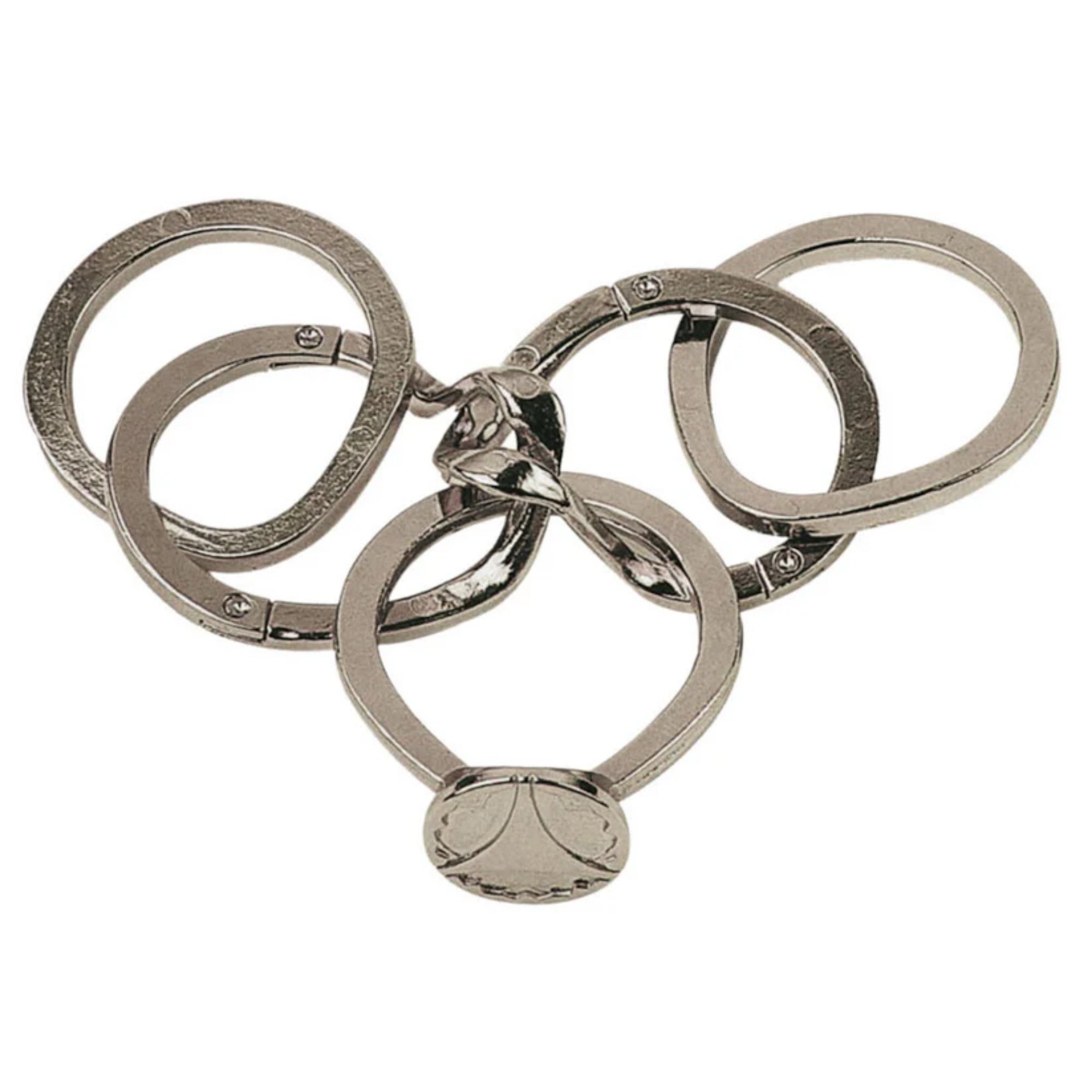 A Huzzle Cast RING II fém kirakó szétszedett állapotban, különálló, ötletesen megmunkált gyűrűrészekkel.