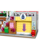 LEGO Friends Heartlake City lakások és üzletek 42670 mosodája tolóajtóval és forgó mosógépekkel.