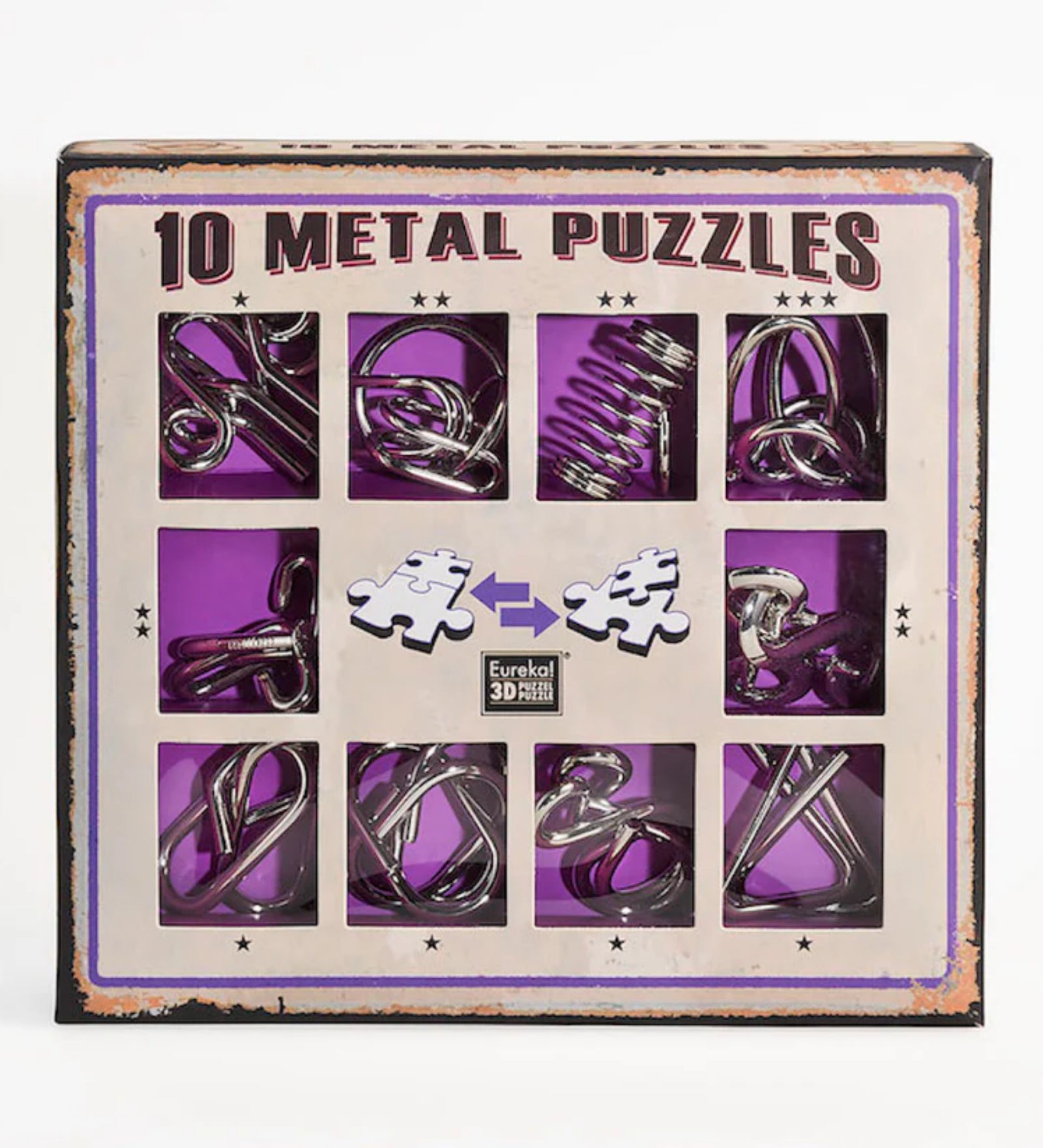 Négyzet alakú kartondoboz, amely tíz különböző fémből készült logikai kirakót tartalmaz, lila háttérrel és „10 Metal Puzzles” felirattal, középen két puzzle darab grafikájával.