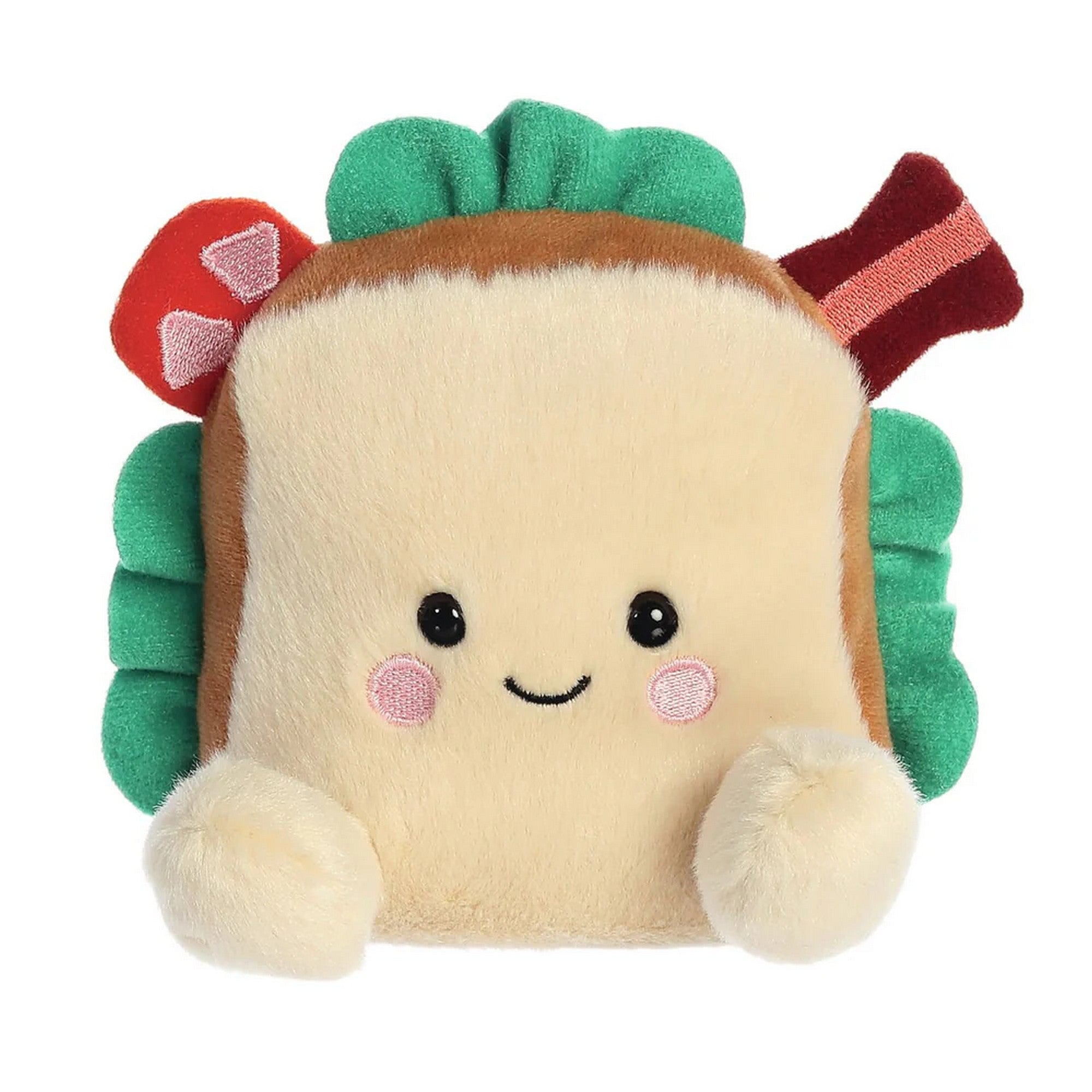 Szendvics formájú plüss játék elölnézetben, mosolygós arccal, saláta és feltétek részleteivel, puha, selymes tapintású anyagból készült aranyos kialakítással