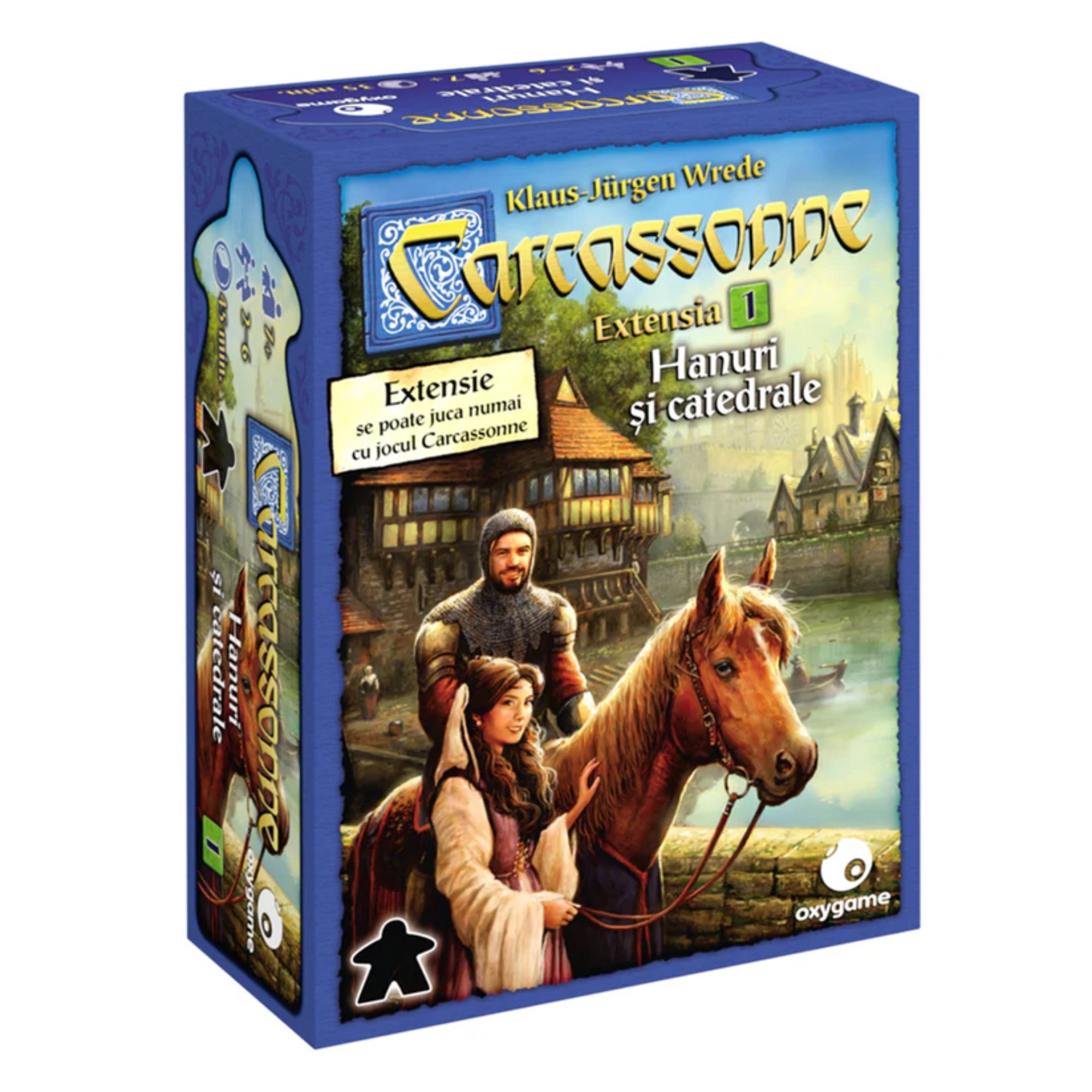 A Carcassonne Hanuri și catedrale kiegészítő dobozának eleje, lovaggal, hölggyel és egy lóval egy középkori város háttérképe előtt. A doboz jelzi, hogy ez az első hivatalos kiegészítő a Carcassonne társasjátékhoz.