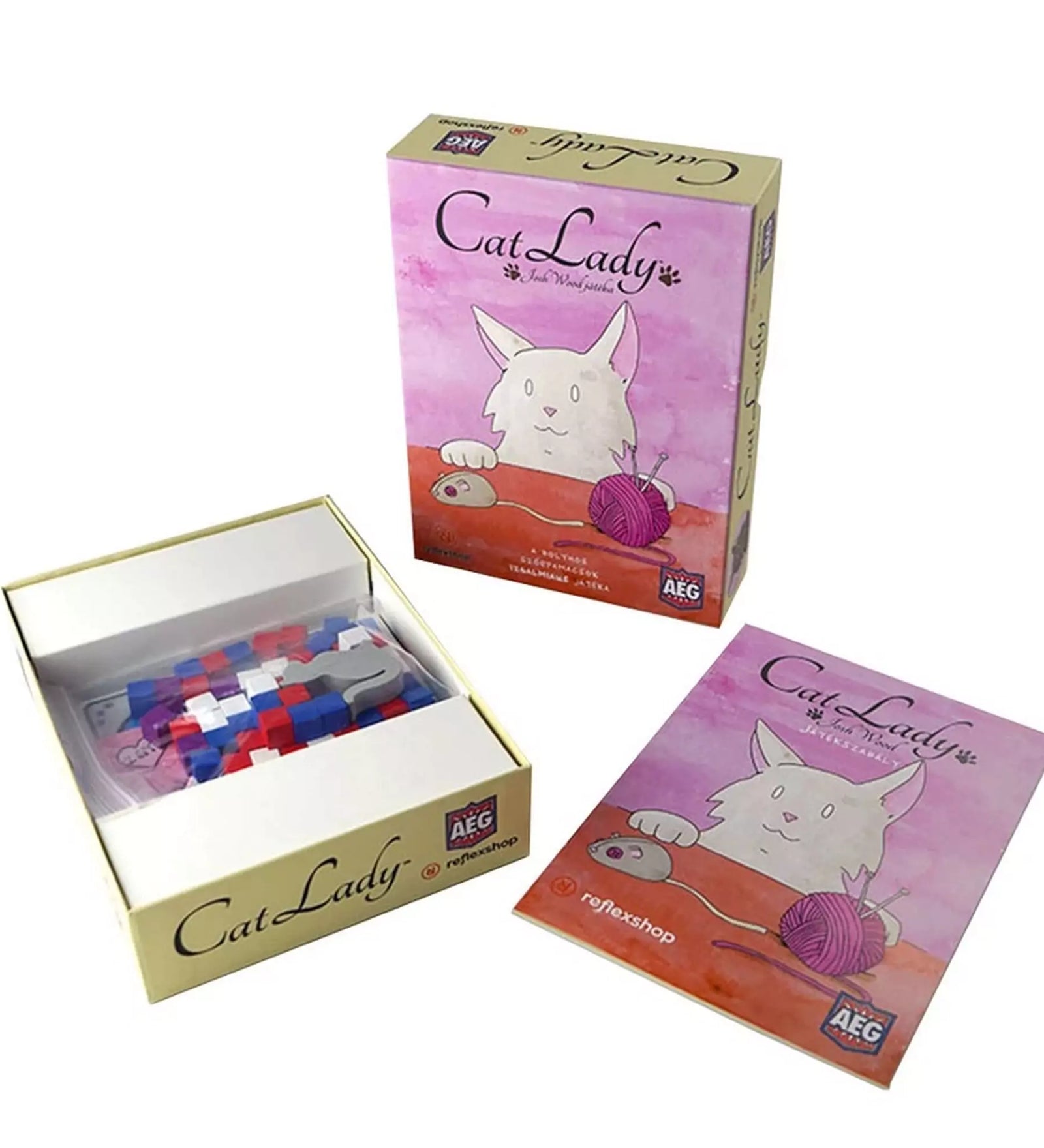 A Cat Lady játék kártyái, kockái és szabálykönyve rendezett dobozban.