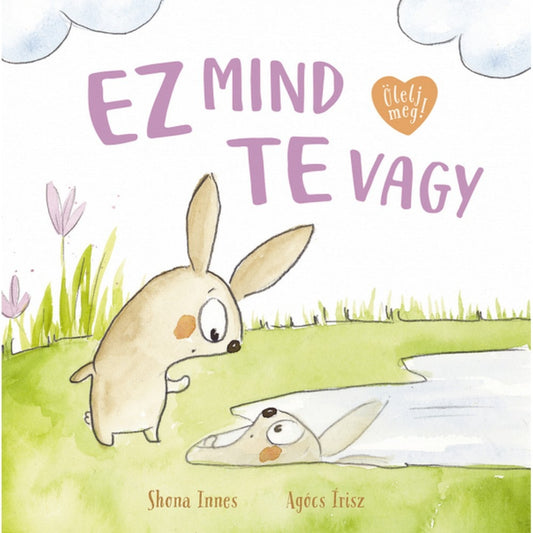 Ez mind te vagy gyerekkönyv borító, kedves nyuszi illusztrációval, ahol egy kis nyúl a vízben tükröződő képét nézi.