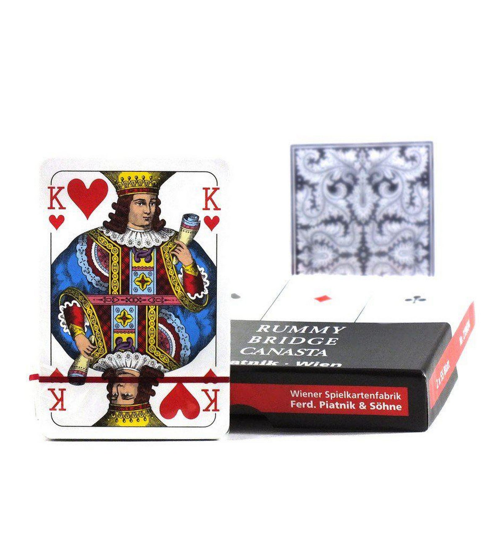 Piatnik Rummy Bridge Canasta kártya készlet – kőr király lap, kártyapakli és mintás hátlapú lapok a doboz mellett.