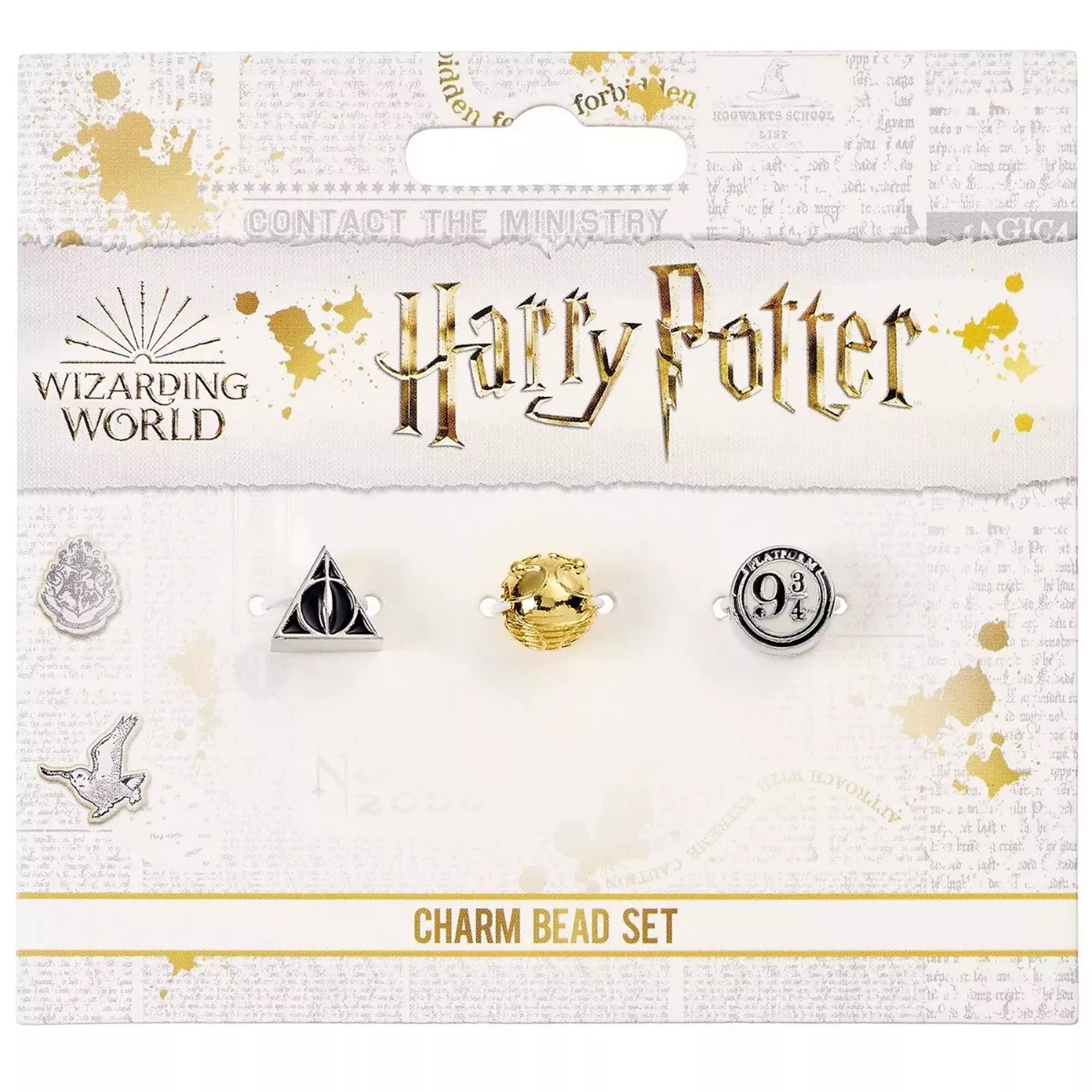 Hivatalos Harry Potter három darabos gyöngy készlet díszes csomagolásban, amely tartalmaz egy Halál ereklyéi szimbólumot ábrázoló gyöngyöt, egy aranycikesz formájú gyöngyöt és egy 9 és 3/4 vágány jelölésű gyöngyöt.