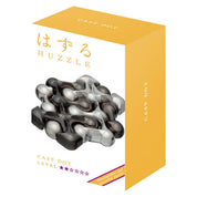 A Huzzle Cast DOT doboza, amelyen a kirakó összeállított változata látható, japán és angol felirattal, sárga-fehér színvilágban és 2/6 nehézségi szint megjelöléssel.