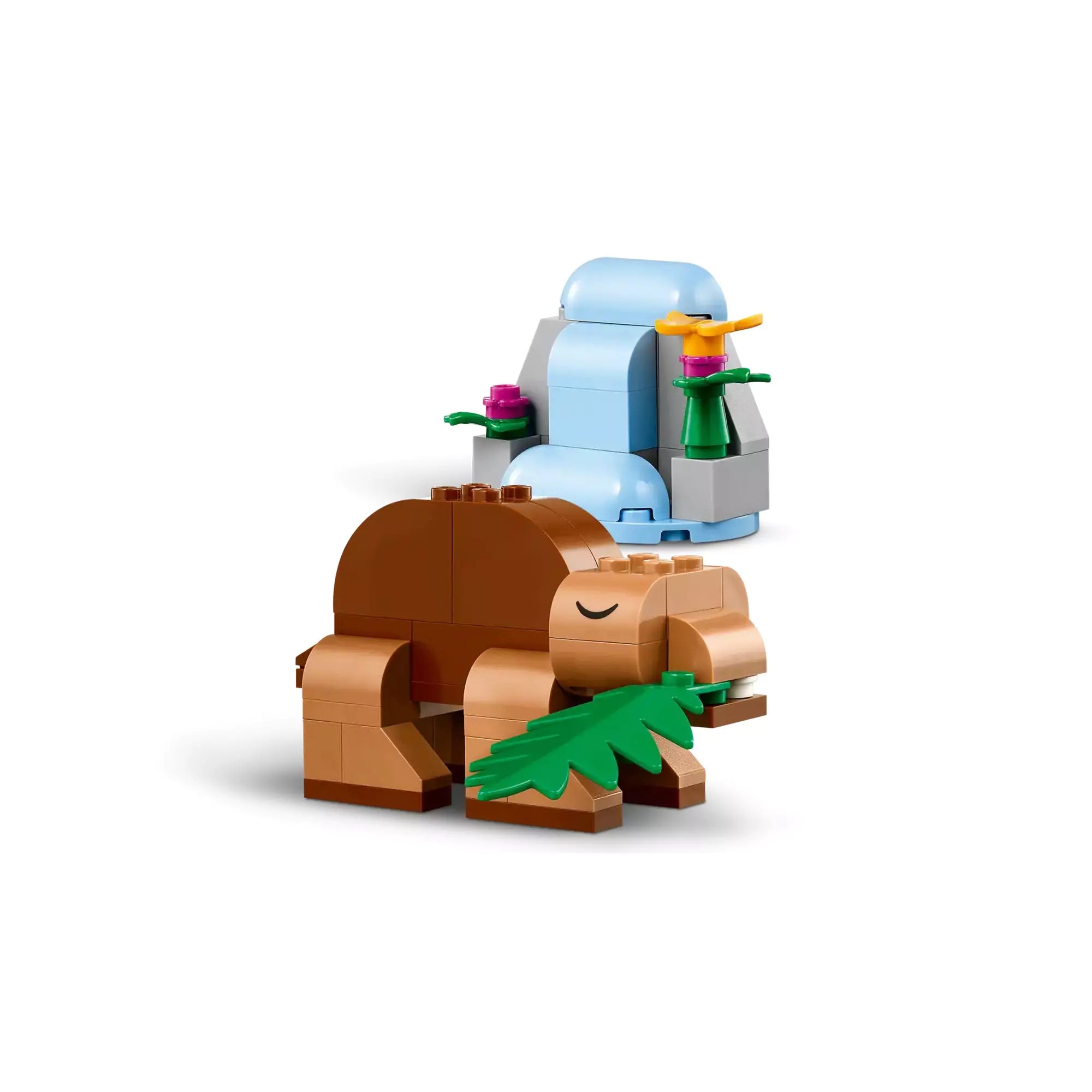 Barna dinoszaurusz növényt eszik egy zöld növény mellett, a "LEGO Classic Kreatív dinoszauruszok (11041)" készletből.