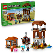 LEGO Minecraft A Fosztogató őrtorony és a Romboló (21278) készlet doboza és a teljes, összerakott játékkészlet, amely magában foglalja az őrtornyot, egy kis kunyhót, a Romboló figurát, és öt minifigurát a sivatagi háttér előtt.