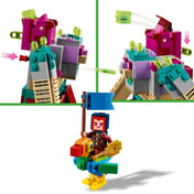LEGO Minecraft A Zabáló leszámolás (21257) funkció bemutató: Zabáló kilövő mechanizmus mozgatható vállrészekkel, alatta zászlós hős papagáj hátán.