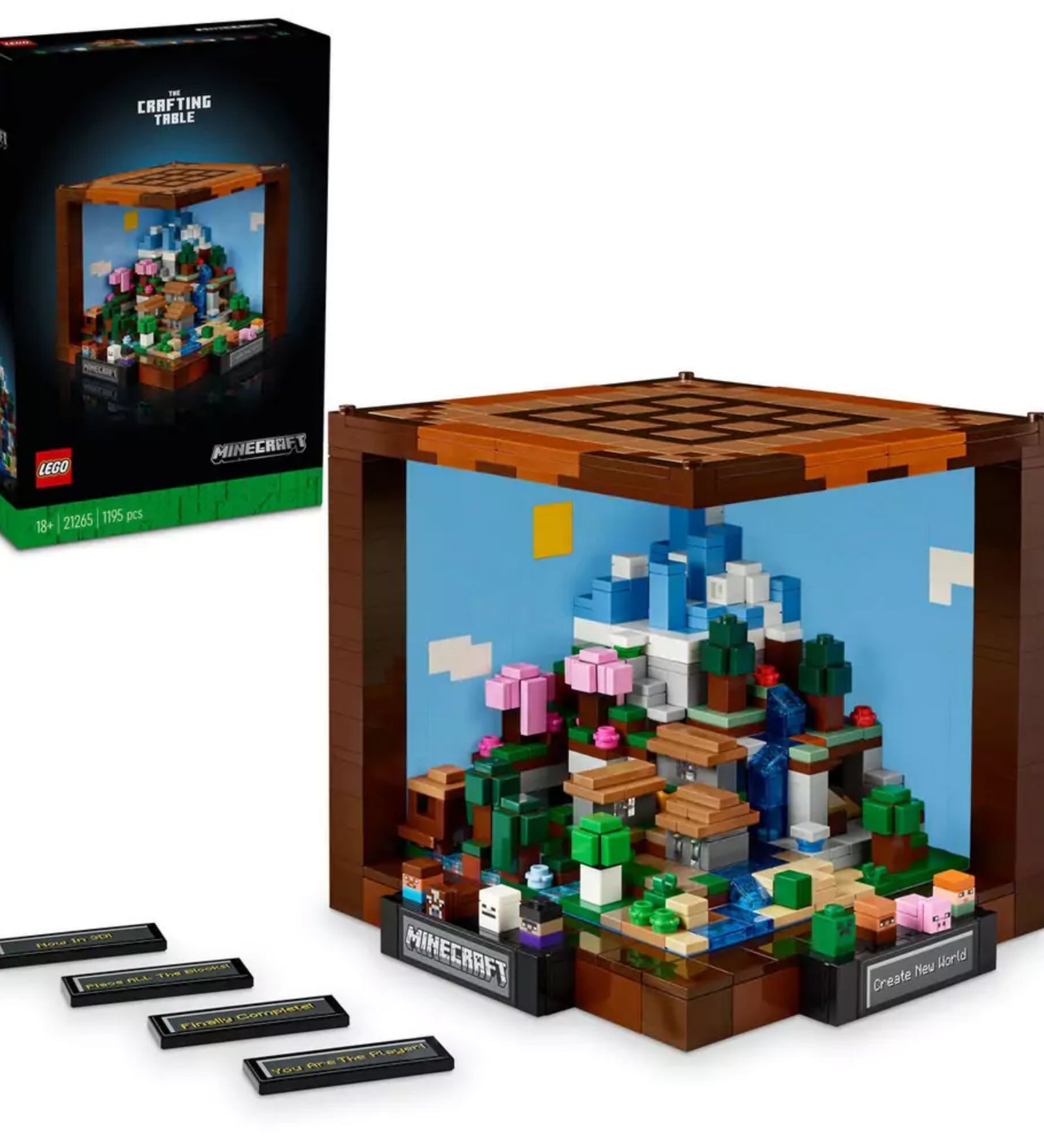 A LEGO Minecraft barkácsasztal készlet doboza és az összerakott díszmodell együtt, cserélhető táblaelemekkel, Minecraft témájú tájképpel és díszes kockafelépítéssel.