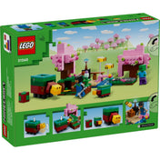 LEGO Minecraft A cseresznyevirágos kert (21260) doboz hátoldala, részletes játékmenet-ábrákkal, mozgatható disznóval, interaktív elemekkel és virágzó fás jelenettel.