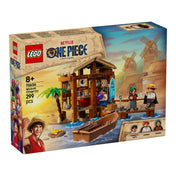 A LEGO One Piece: Windmill Village Hut (75636) doboz eleje, rajta a hangulatos tengerparti kunyhó, a három karakter minifigurája és a sorozat logója a háttérben látható szélmalmokkal.
