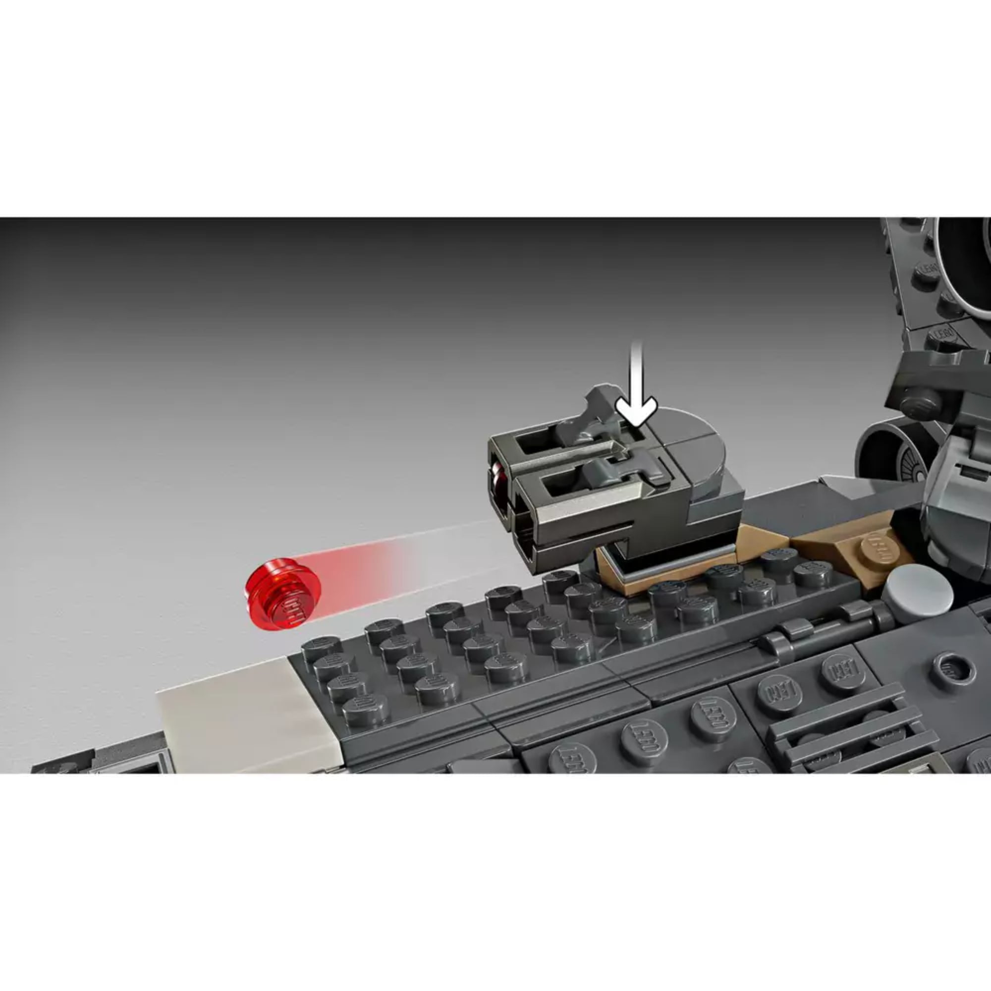 A LEGO Star Wars Onyx Cinder (75374) egyik beépített kilövője közelről, piros lövedékkel és lenyomható kilövő gombbal illusztrálva.