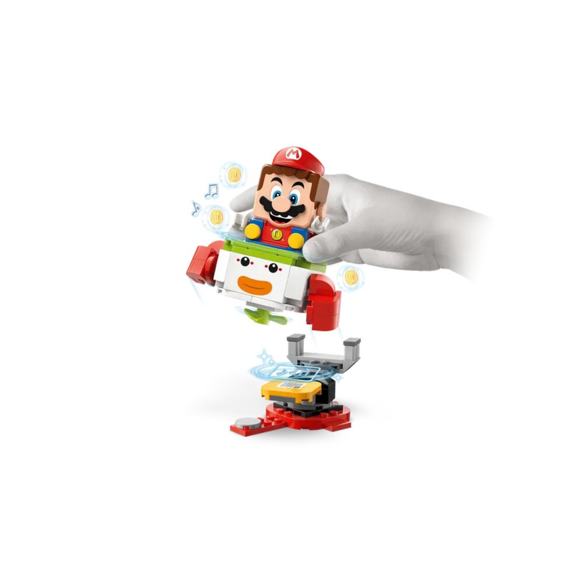 Az interaktív LEGO Mario figura a Junior Clown Car repülőben ülve, alatta egy digitális érzékelővel ellátott platform, a mozgást és hangot kiemelő játékmenet részeként a 71439 készletből.