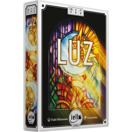 LUZ magyar nyelvű társasjáték doboza látványos, színes katedrális ólomüveg ablak grafikával és aranyfényű dizájnnal.