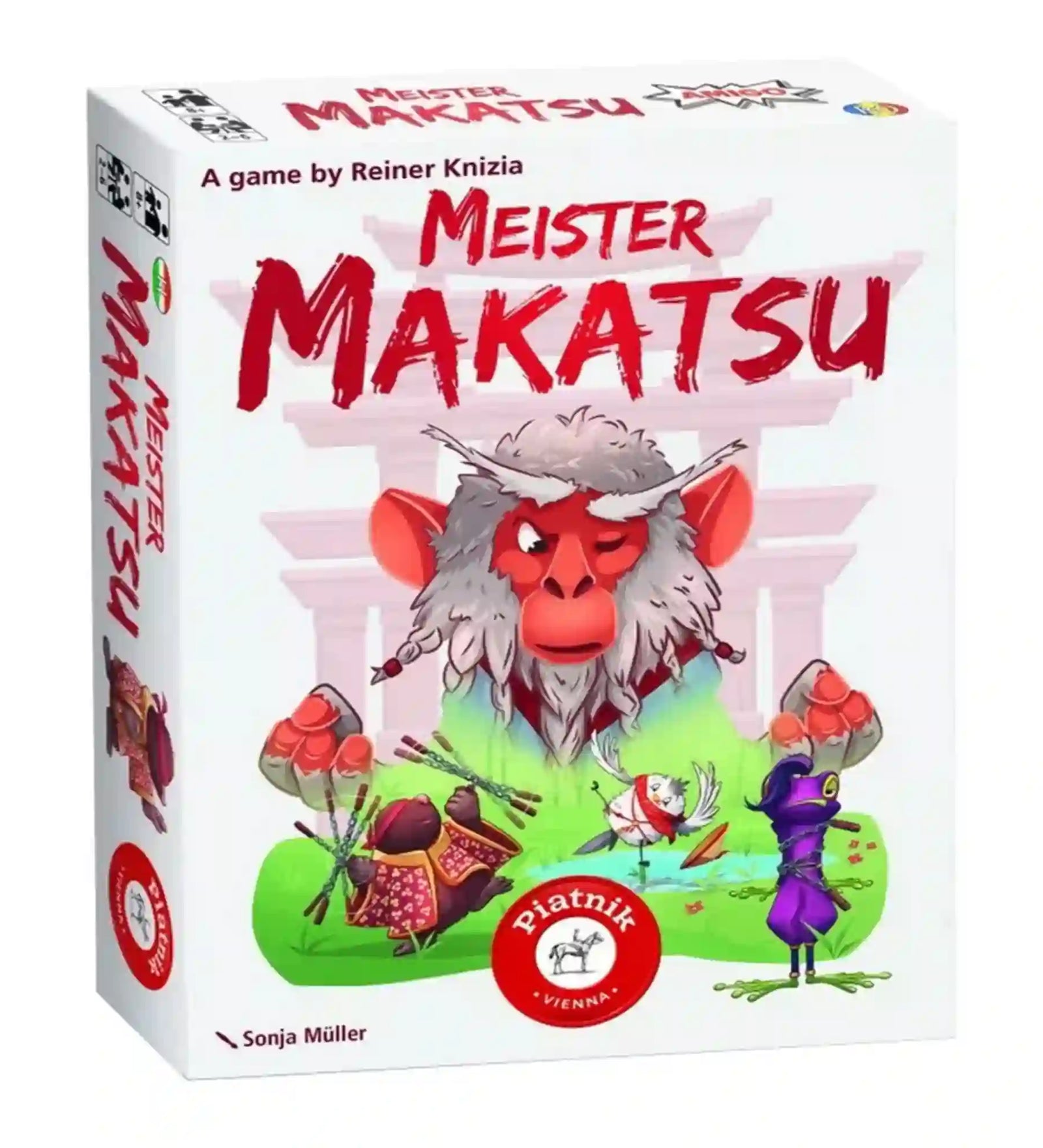 A Meister Makatsu társasjáték doboza japán ihletésű grafikával, középen egy tekintélyt parancsoló vörös arcú majommesterrel. A dobozon színes madár- és harcosfigurák jelennek meg, amelyek a játék taktikai és könnyed hangulatát idézik.