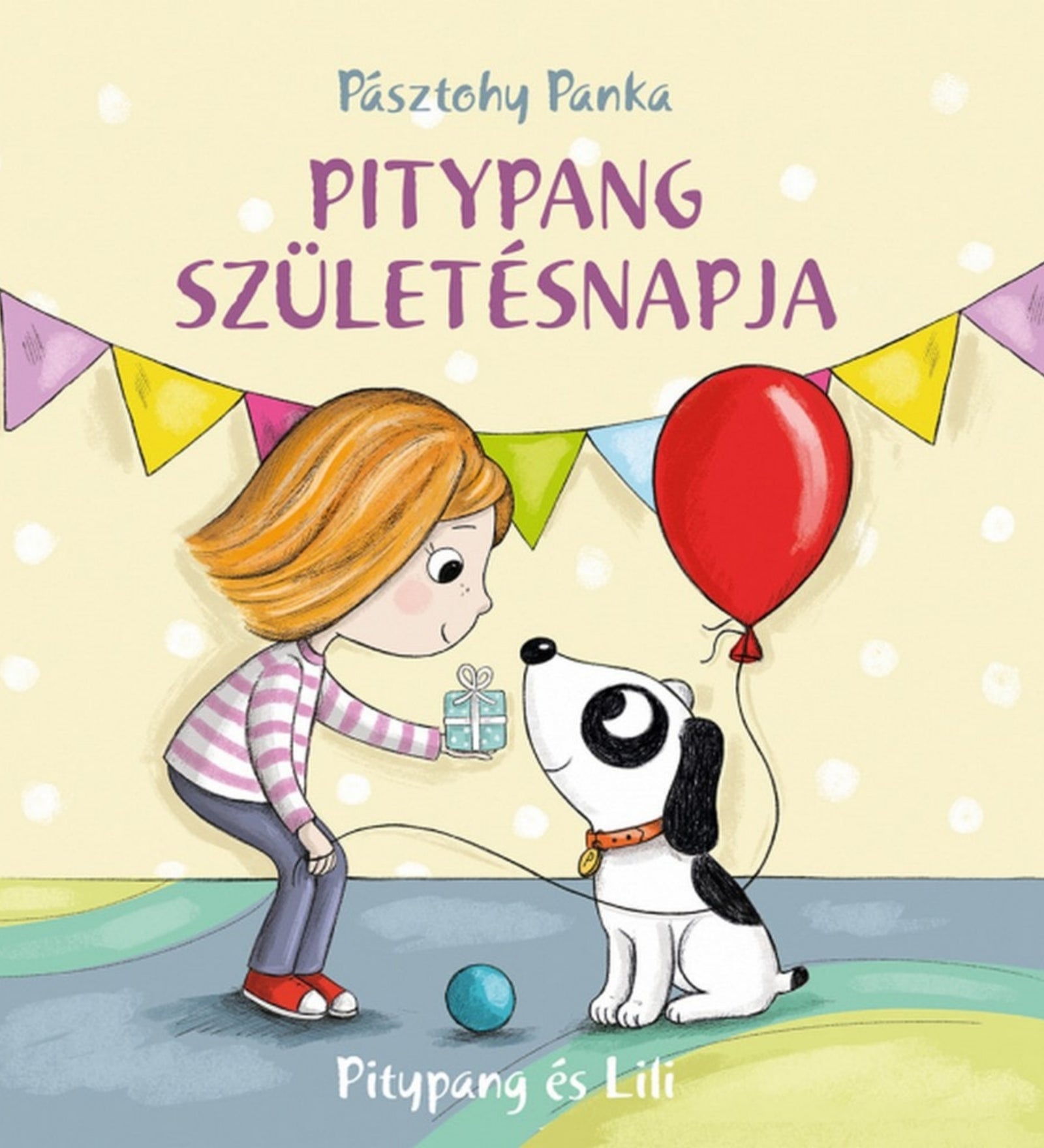 A könyv borítóján Lili boldogan nyújt ajándékot Pitypangnak, a kedves kutyusnak, egy születésnapi ünneplés részeként. A háttérben színes zászlók és lufi láthatók.