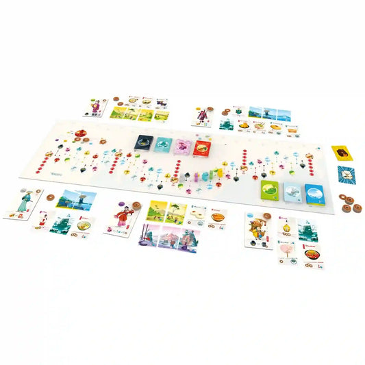 Tokaido társasjáték teljes játékkészlete, hosszú játéktáblával, kártyákkal és játékos elemekkel elrendezve.