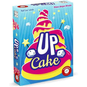Az Up Cake társasjáték színes, vidám doboza, amely egy emeletes tortát ábrázol csillagokkal és dobókockákkal díszítve.