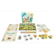 A Zümmögő társasjáték teljes tartalma: doboz, játékszabály, virágos tábla, méhecskés korongok, mézes receptek és színes faelemek, kedves rajzokkal díszítve.