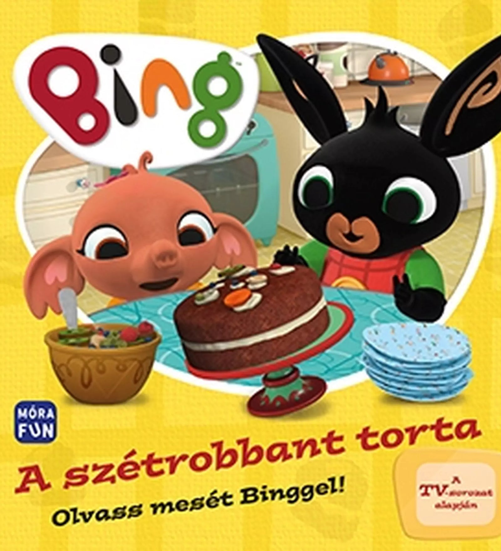 A szétrobbant torta című gyerekkönyv borítója, amelyen Bing és Sula egy asztalnál ülnek egy csokoládétorta mellett. A háttérben konyhai jelenet látható, a borítón szerepel a Móra Kiadó logója és a „TV-sorozat alapján” felirat is.