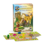 Carcassonne: Kereskedők és Építőmesterek kiegészítő doboza, városokat és utakat ábrázoló lapkákkal, színes fafigurákkal és árulapkákkal.