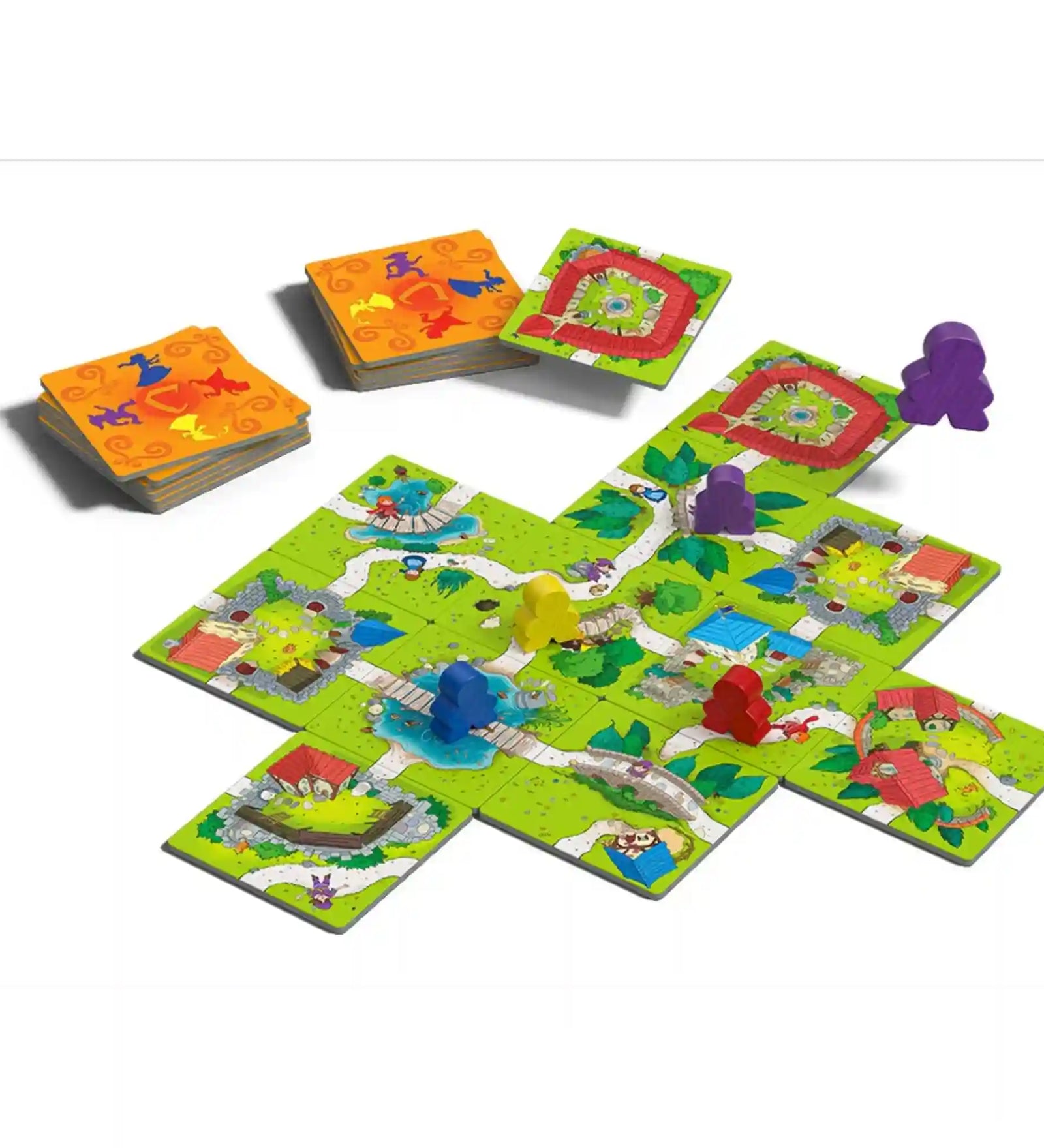Carcassonne Junior játék közben kirakott pálya színes figurákkal és kártyapaklival