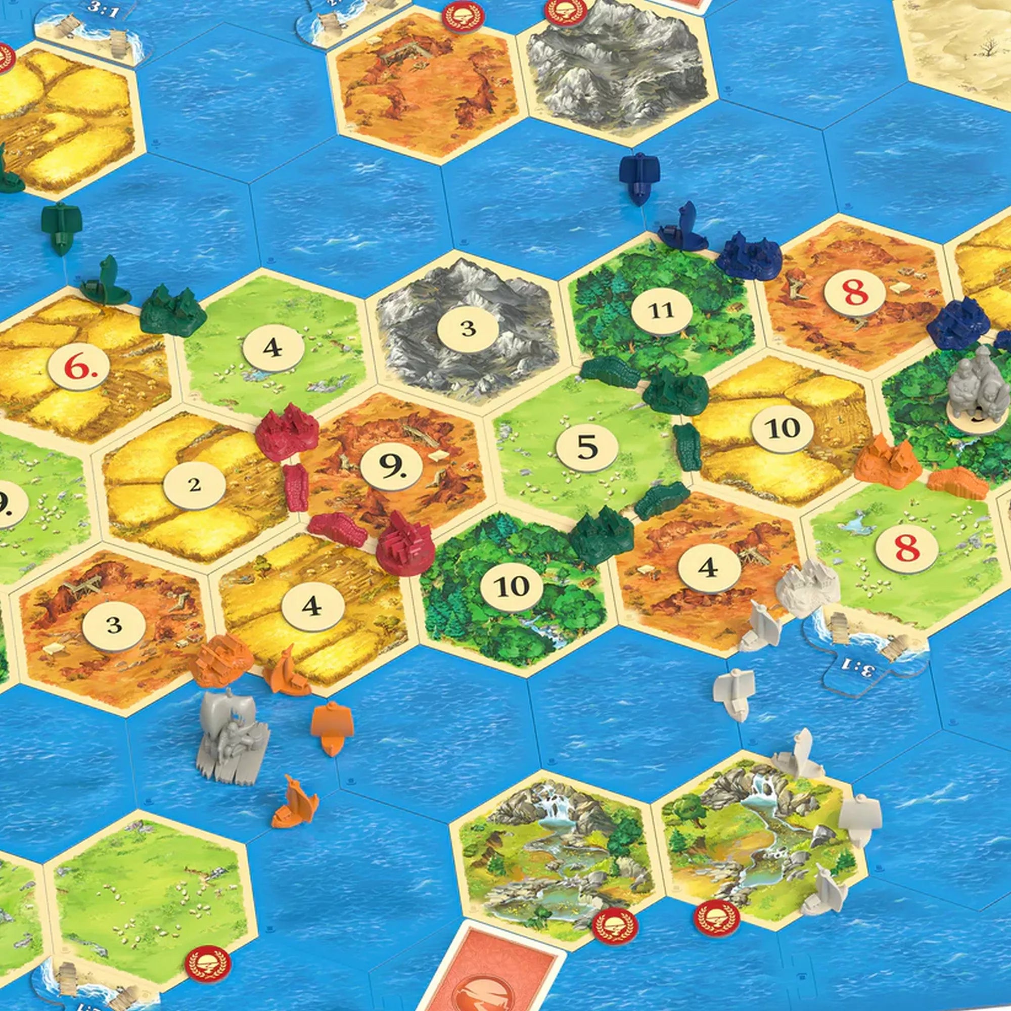 Catan: Navigatorii 5–6 játékos kiegészítő játéktábla. Hexagonális mezők, hajófigurák és szigetek láthatók a kiterített tengeri térképen.