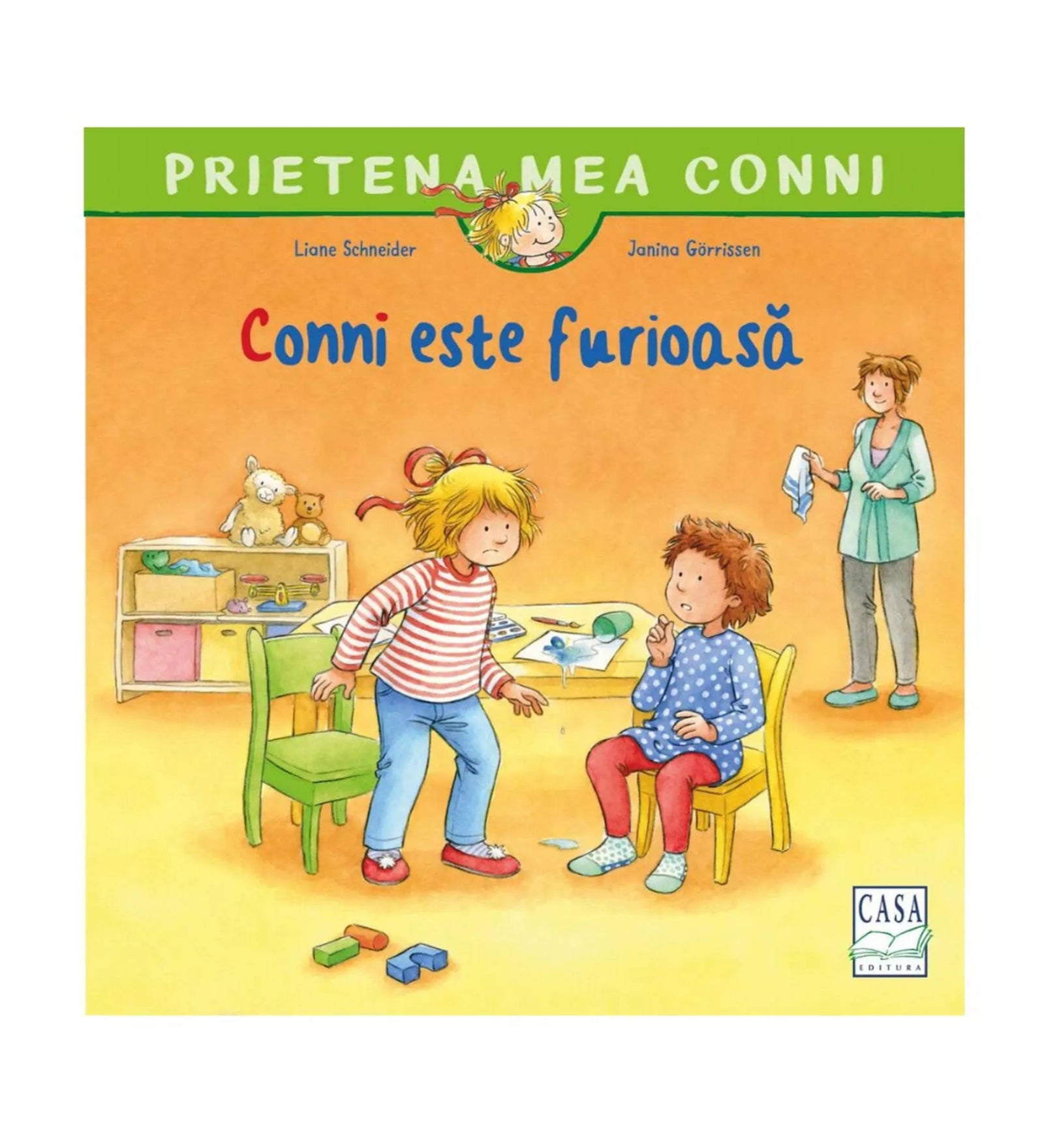 A könyvborító látható a képen: „Prietena mea Conni – Conni este furioasă”. A rajzolt illusztráción Conni dühösen áll egy zöld szék mellett, vele szemben egy kisfiú ül sárga széken, miközben egy felnőtt nő mosolyogva figyeli őket a háttérből.