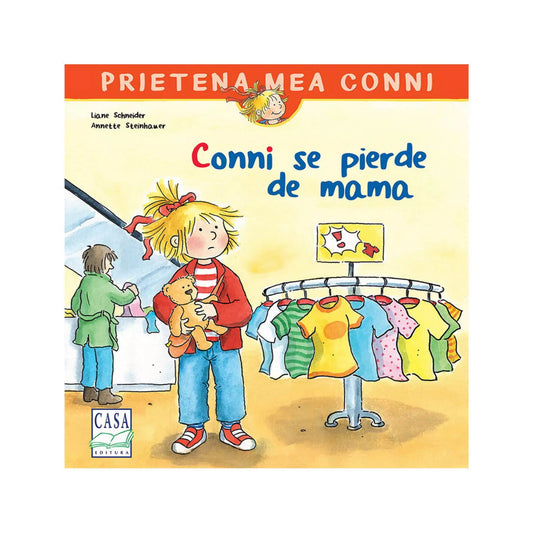 A kép a „Conni se pierde de mama” című gyerekkönyv borítóját ábrázolja. A rajzon Conni egy plüssmackót szorongatva áll egy ruhaboltban, mellette színes pólók lógnak egy állványon, a háttérben egy felnőtt alak látható a pénztárnál.