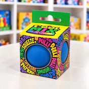 Cool Mix színváltós squishy stresszlevezető játék (kék), színes, feliratos dobozban, kerek nyílásokon keresztül látható kék labdával.