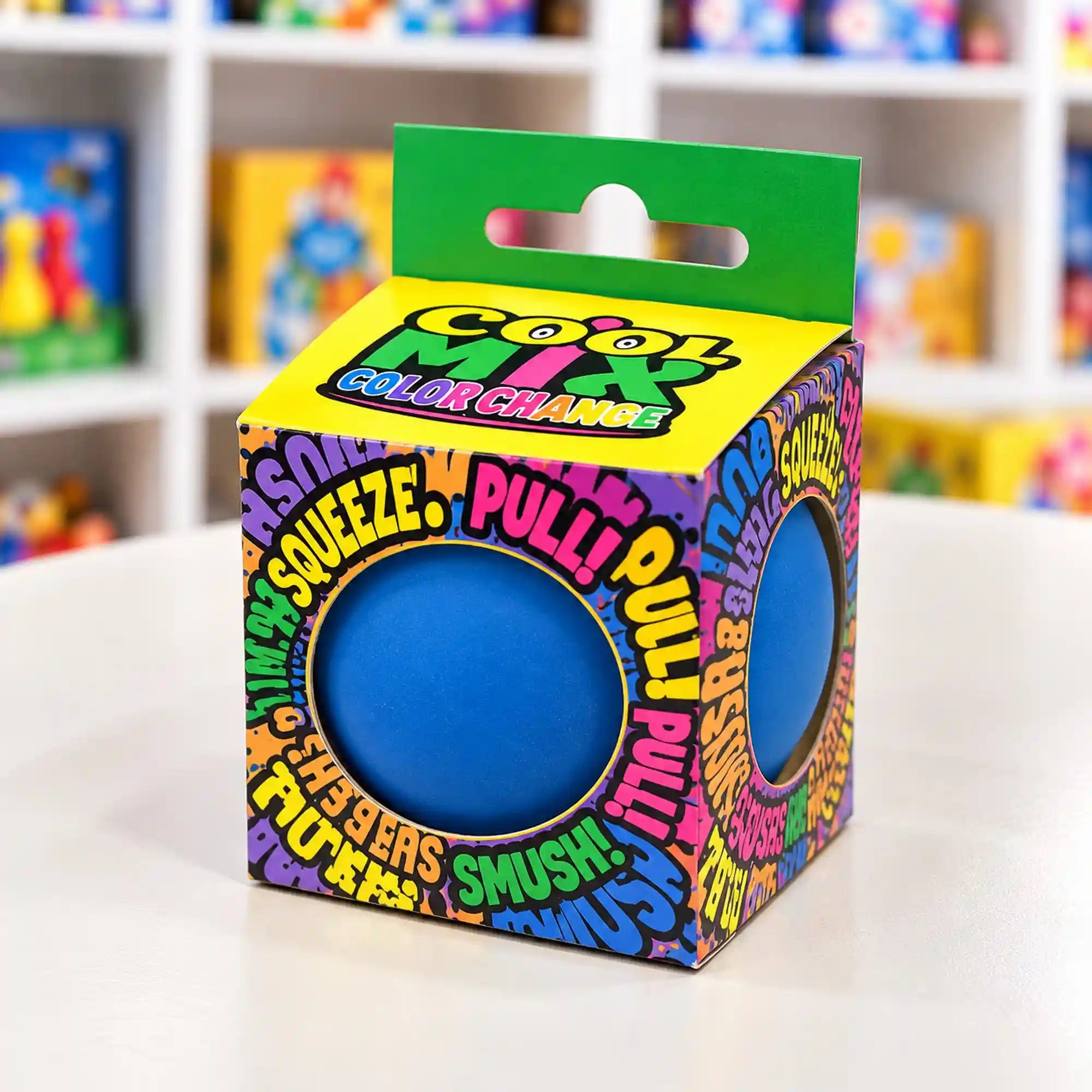 Cool Mix színváltós squishy stresszlevezető játék (kék), színes, feliratos dobozban, kerek nyílásokon keresztül látható kék labdával.
