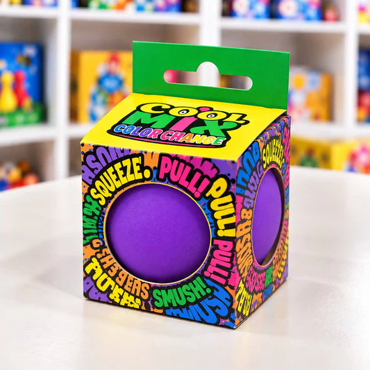 Cool Mix színváltós squishy stresszlevezető játék (lila), színes feliratokkal díszített dobozban, két kerek nyíláson keresztül látható lila labdával.
