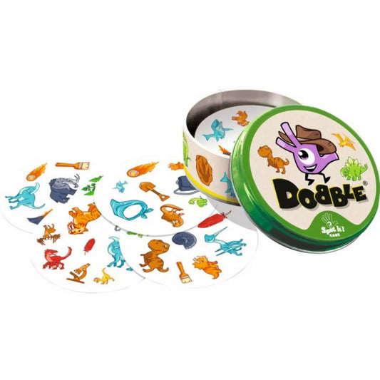 Nyitott Dobble Dínók fémdoboz színes kártyákkal, amelyeken különböző dinoszaurusz és őskori szimbólumok láthatók.