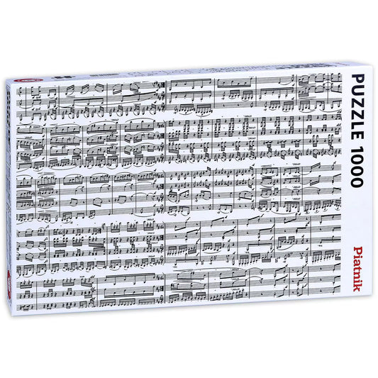 „A Hangjegyek 1000 darabos Piatnik puzzle doboza fekvő formátumban, amely zenei kottát ábrázol aprólékos hangjegyekkel és szimbólumokkal.”