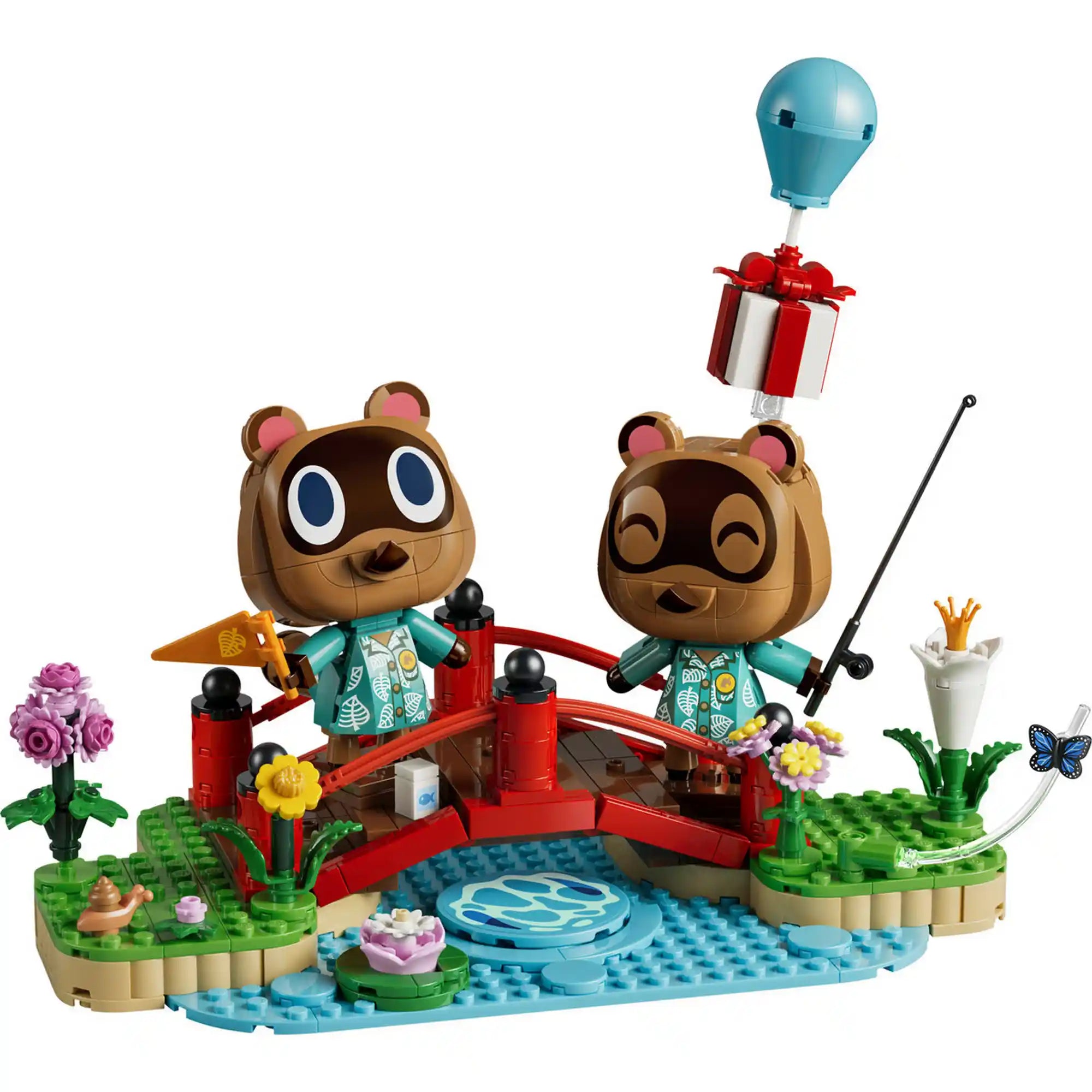 A LEGO Animal Crossing: Timmy és Tommy vidám kirándulása 77059 összeépített modellje Timmy és Tommy figuráival, piros híddal, virágokkal, horgászbottal, lebegő ajándékkal és a részletgazdag tóparti környezettel.