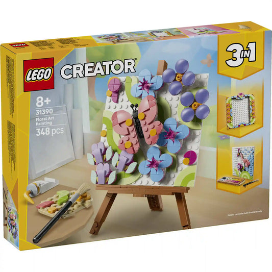 LEGO Creator 3 az 1-ben Virágos műalkotás (31390) készlet elülső dobozképe. A 348 darabos, 8 éves kortól ajánlott szett egy színes virágos alkotást ábrázol pillangóval, festőállvánnyal és művészeti kiegészítőkkel.