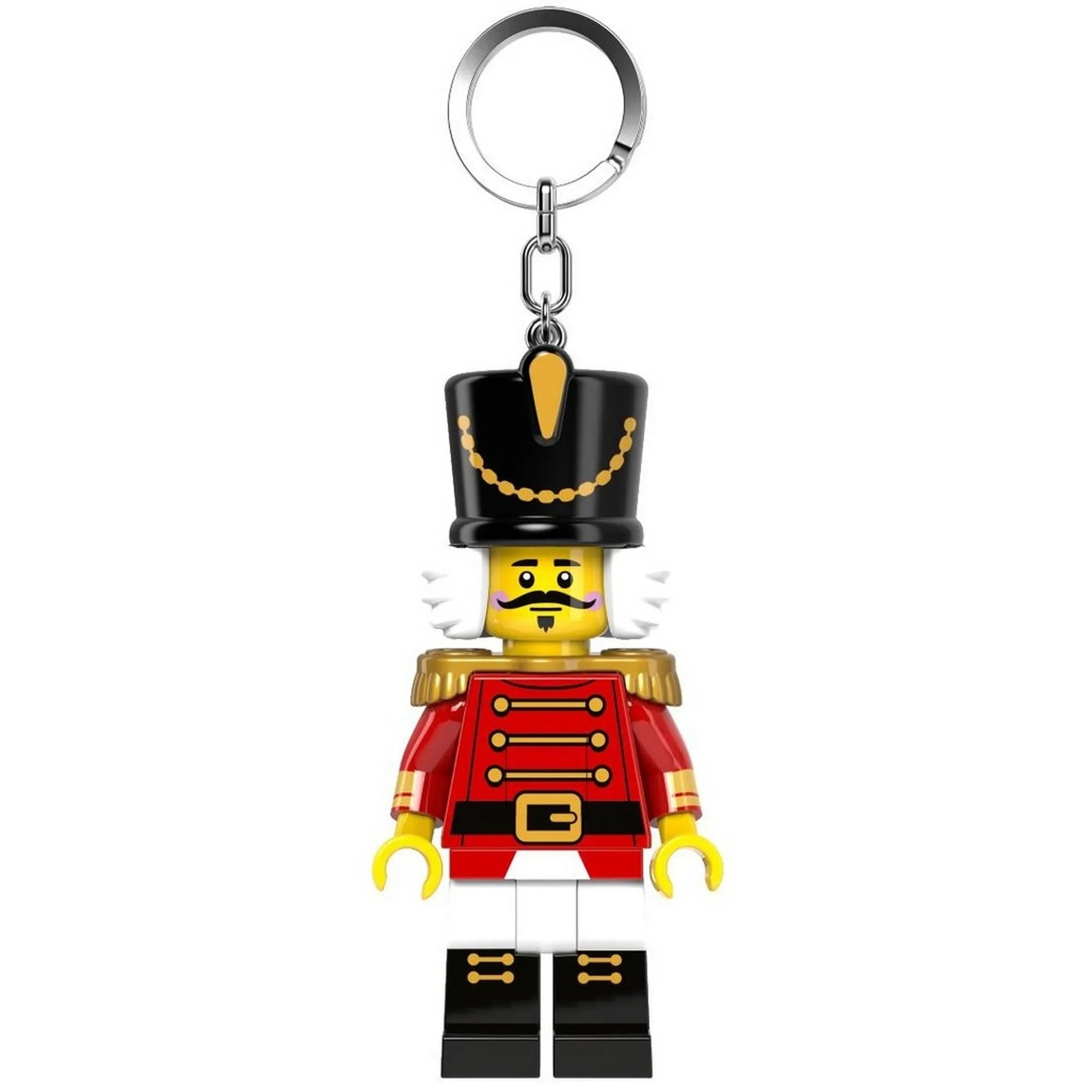 A LEGO Diótörő minifigura alakú kulcstartó elölről látható, piros díszruhában, fekete magas sapkával és arany vállpántokkal.