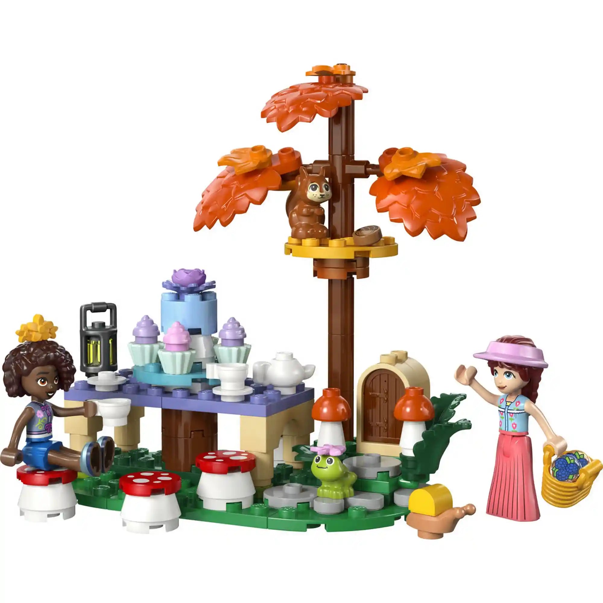 LEGO Friends Erdei teázás készlet forgó süteményállvánnyal, teáskészlettel, erdei fával, tündérajtóval és állatfigurákkal.