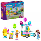 LEGO Friends Jégkrémes és lufis stand (42692) doboza és a megépített készlet egy képen, jól látható jégkrémes biciklis standdal, minifigurákkal és színes kiegészítőkkel.