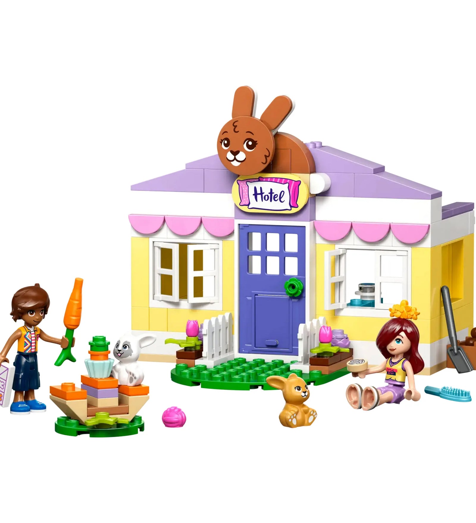 LEGO Friends Heartlake City nyuszipanzió (42679) teljes készlet fehér háttéren, épülettel, figurákkal és kiegészítőkkel