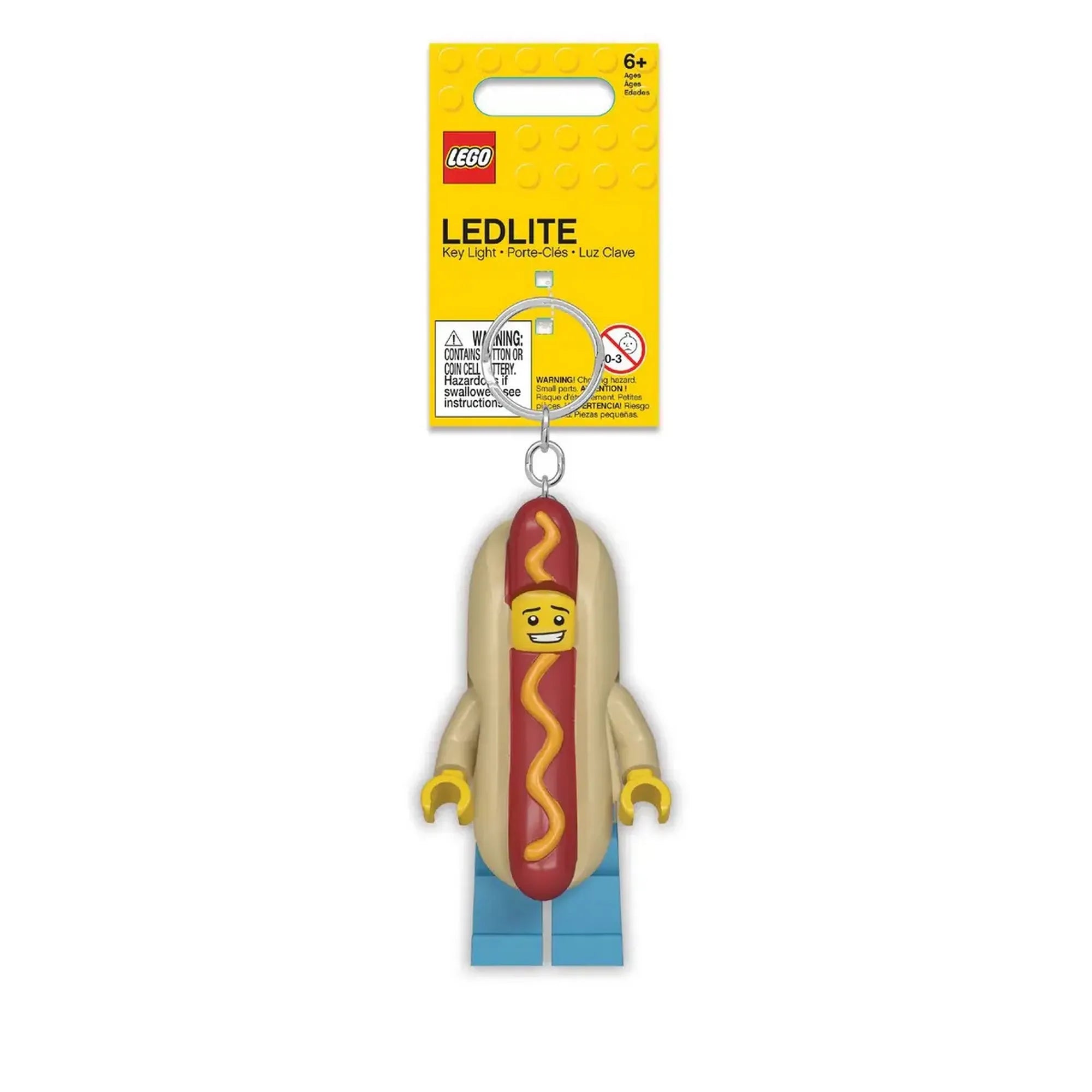 A LEGO világító kulcstartó Hot Dog figura dobozos kiszerelésben. Sárga LEGO csomagolás, láncon lógó minifigura formájú kulcstartó LED-es világítással.
