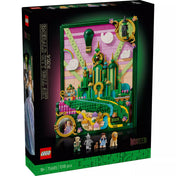 A LEGO Wicked Emerald City falikép (75685) doboza elölnézetből, élénk zöld, rózsaszín és sárga színekkel megépített 3D-s Emerald City jelenettel. A doboz alján a hat minifigura – Glinda, Elphaba, Dorothy, Toto, Bádogember és Oroszlán – látható, a háttérben pedig a hőlégballon és a város tornyai.