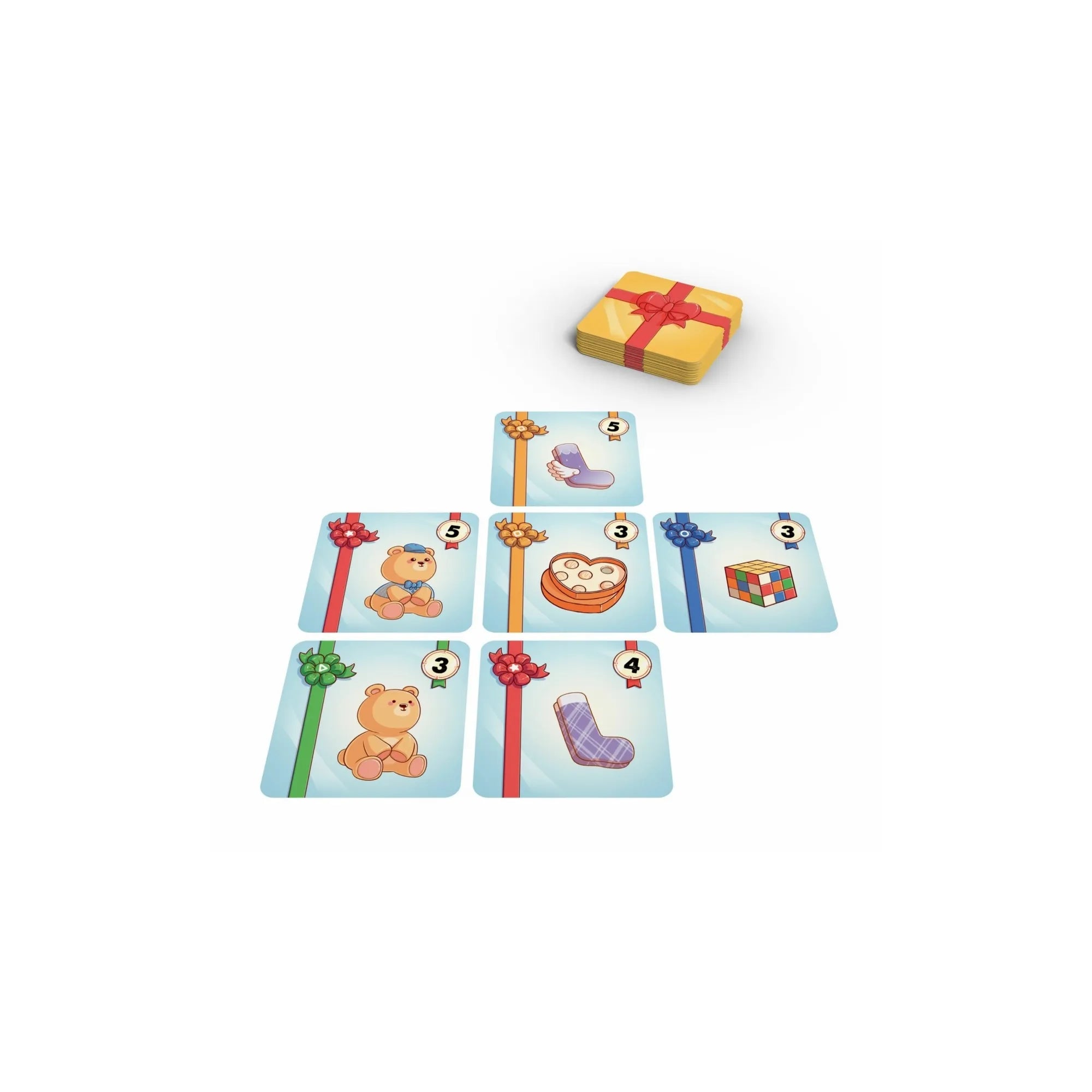 A Meglepi! társasjáték néhány kártyája az asztalon elrendezve, játék közbeni helyzetet bemutatva, középen a pakli.