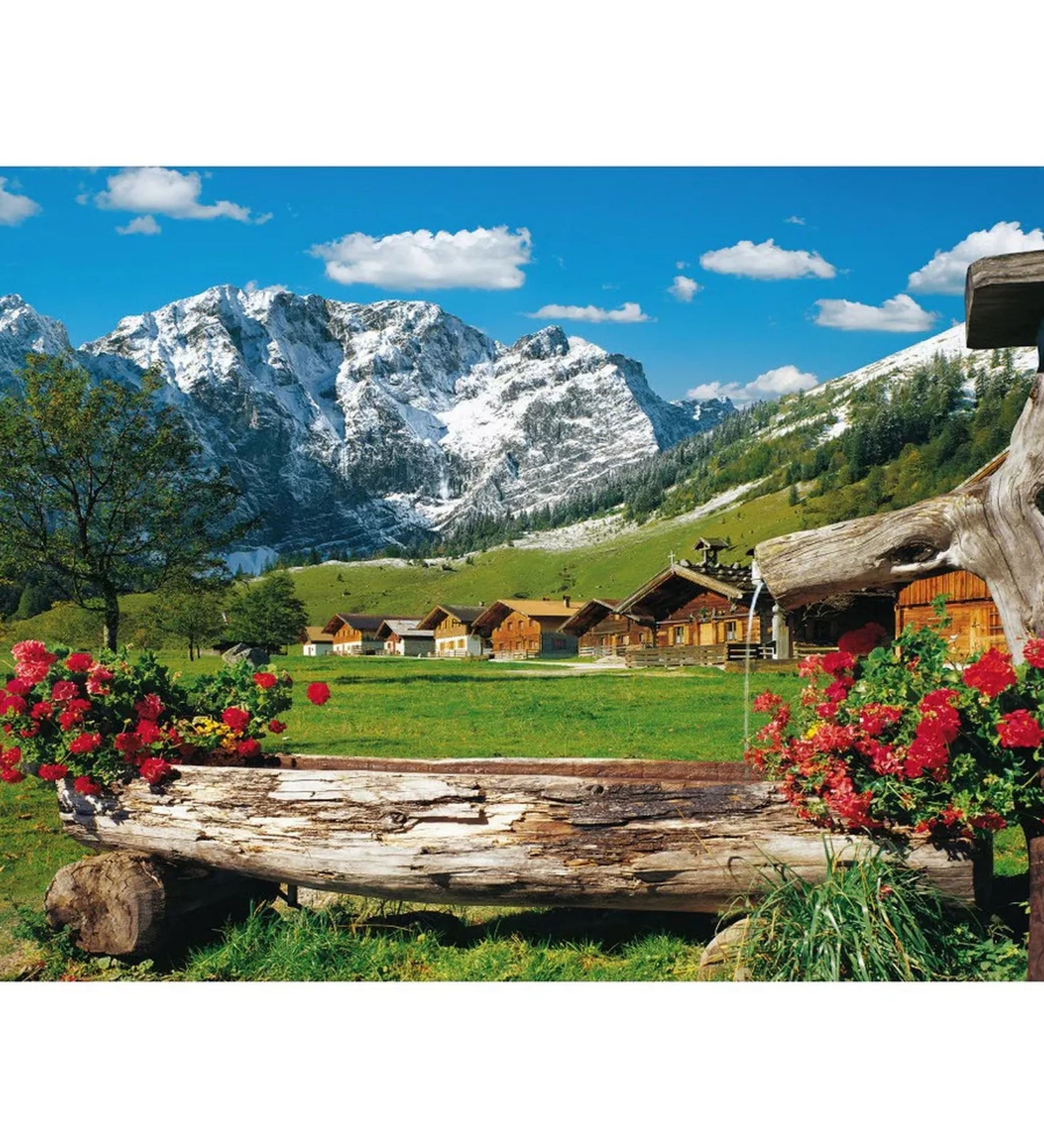 Alpesi hegyi táj faházakkal, hófödte hegycsúcsokkal és virágos fa vályúval a Schmidt 1000 darabos puzzle képén