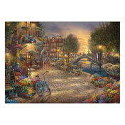 „Puzzle Schmidt: Thomas Kinkade – Amszterdam, 1000 darabos kirakó képe, részletes festmény Amszterdam csatornáiról és virágos utcáiról.”