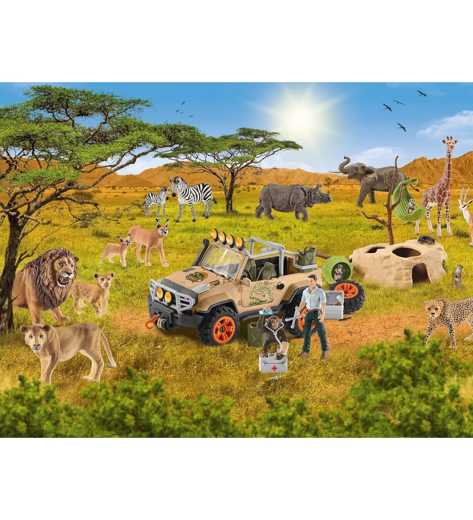 A Schleich Wild Life 60 darabos kirakott puzzle részletgazdag szavannai jelenete, oroszláncsaláddal, zebrákkal, elefánttal, zsiráffal, gepárddal, terepjáróval és állatmentő figurával a napsütötte afrikai tájon.