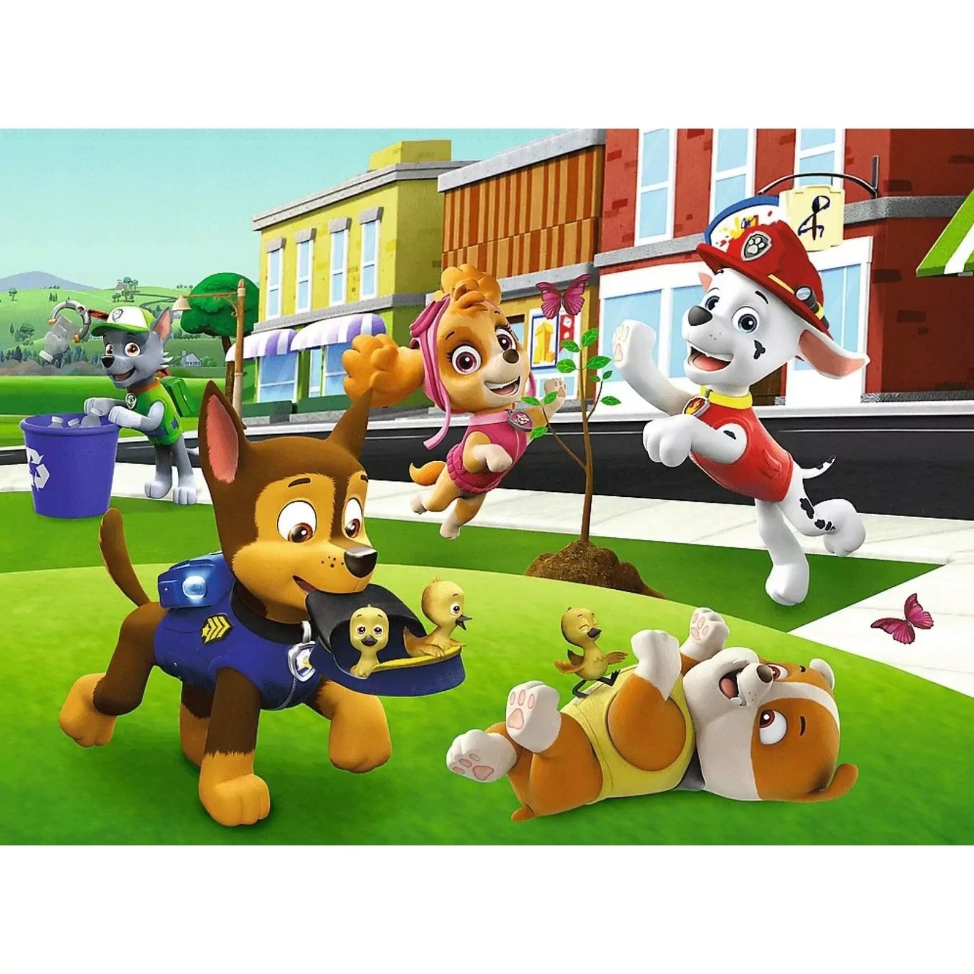 A kirakott puzzle képe, amelyen Chase, Skye, Marshall és Rubble vidáman játszanak egy parkban.