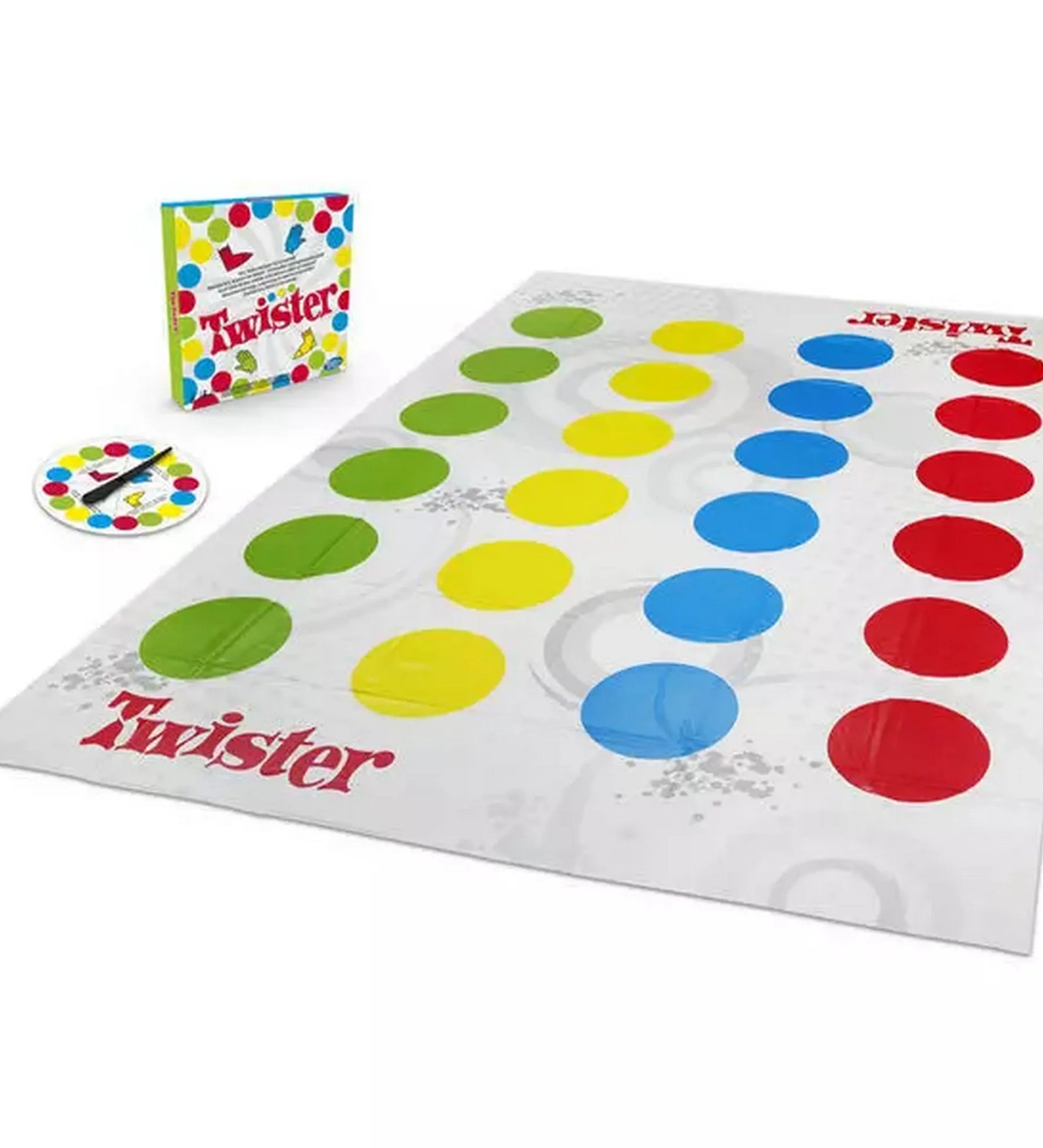 A Twister játék teljes készlete: színes pöttyös játékmező, pörgető és a doboz egymás mellett.
